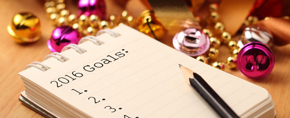 New Year's goals with colorful decorations. New Year’s goals are resolutions or promises that people make for the New Year to make their upcoming year better in some way.
