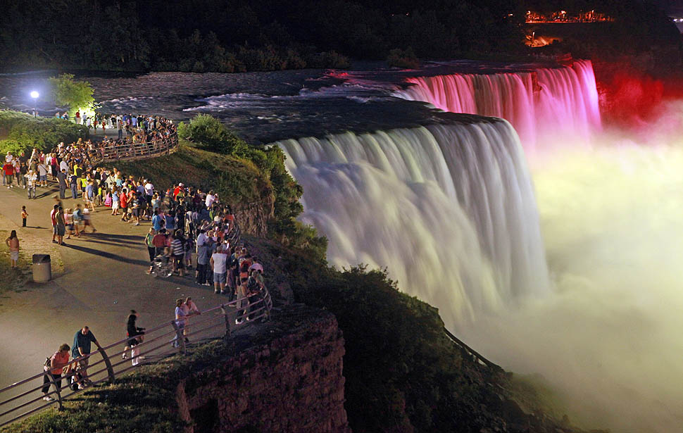 Niagara falls lit up at night