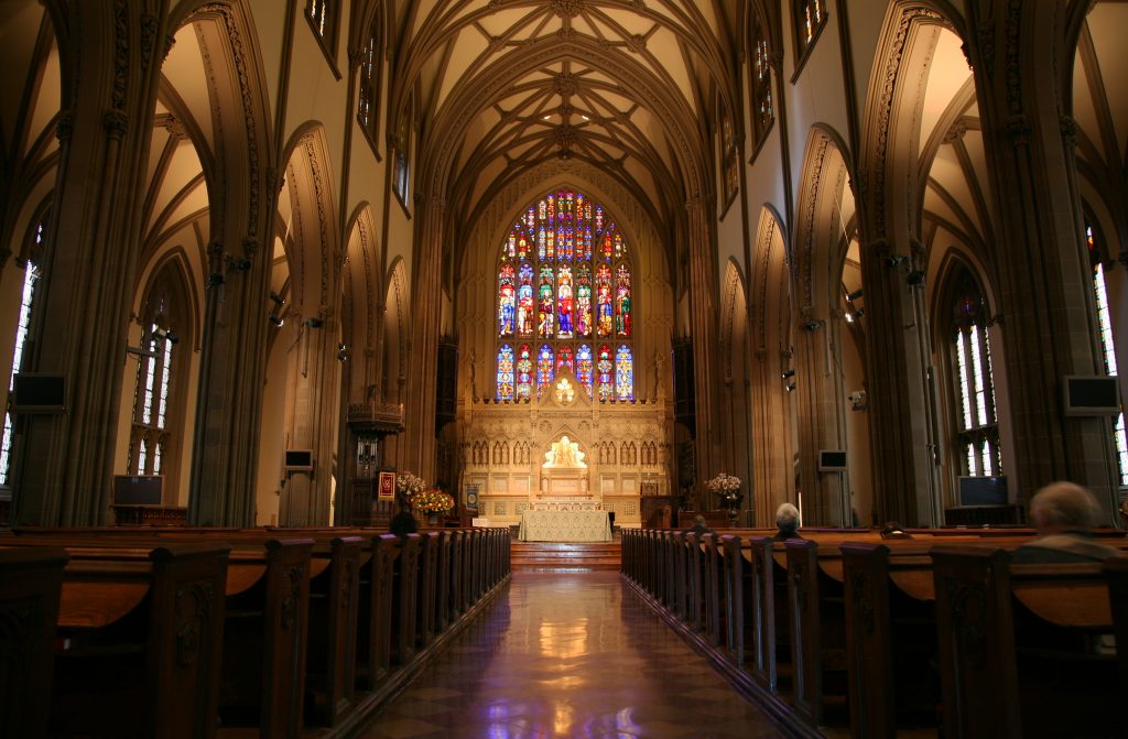 New York City Trinity Church with Stained glass windows and tall arches ceilings