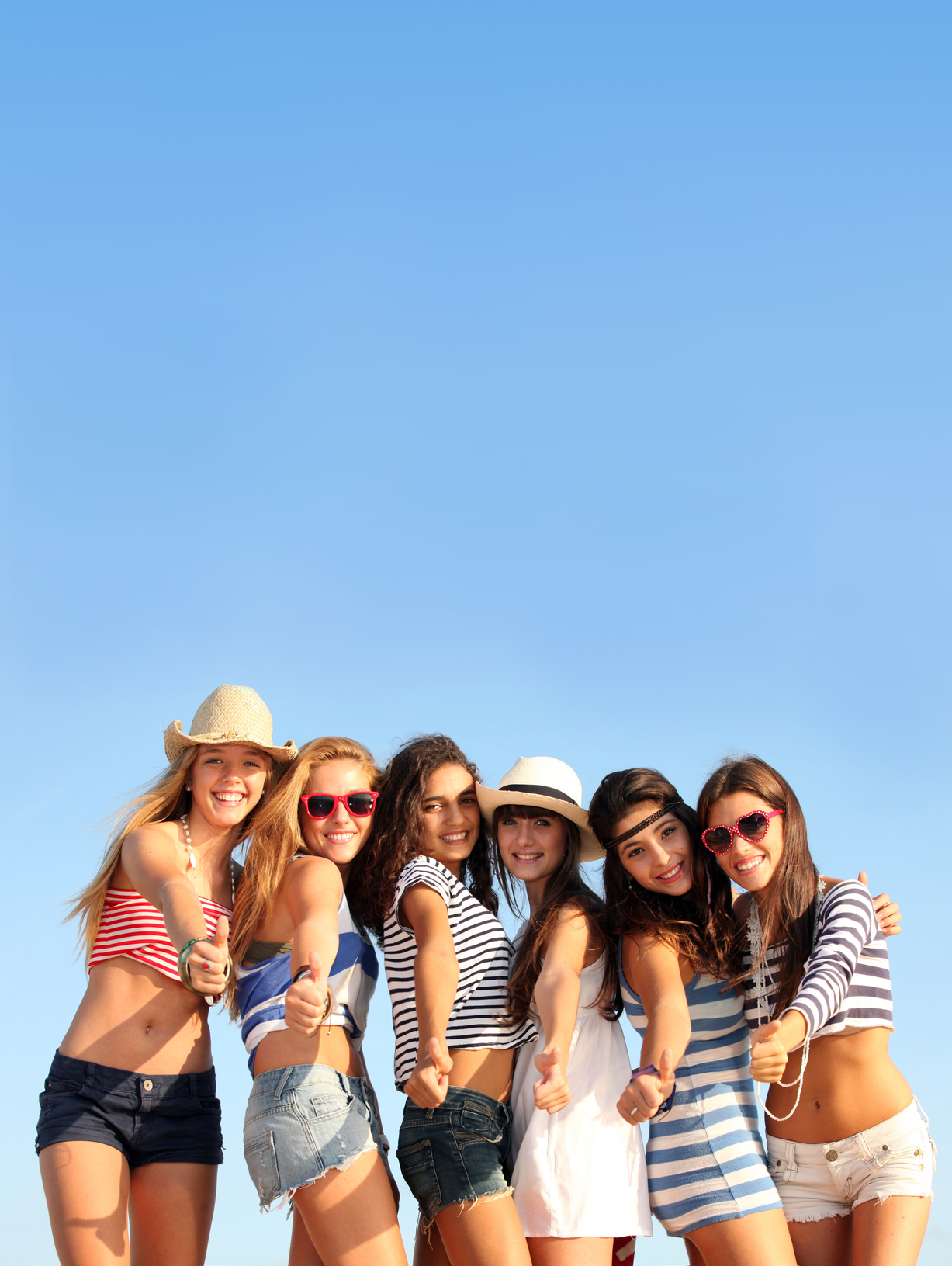 group of teens on beach summer vacation or spring break