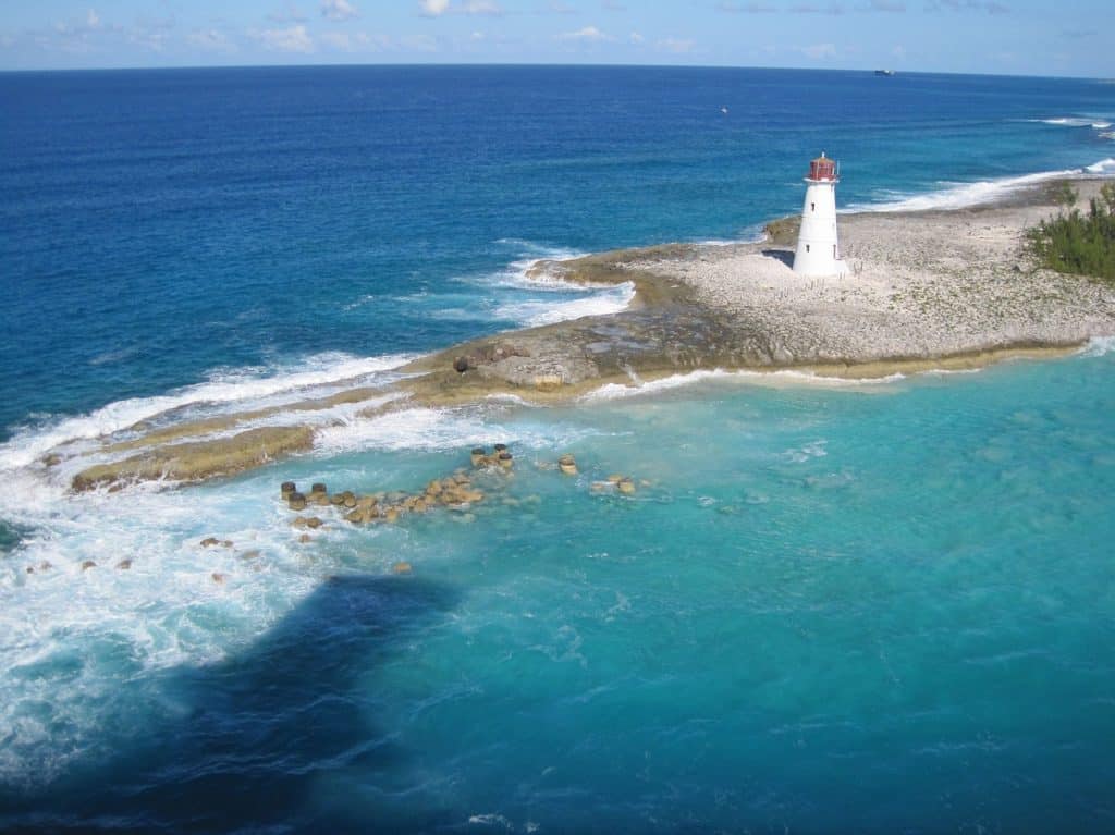 Bahamas ocean with lighthouse on sandbar