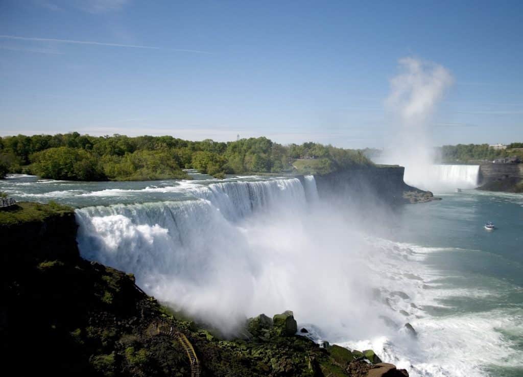 Arial view of Niagara falls with boat tour in distance